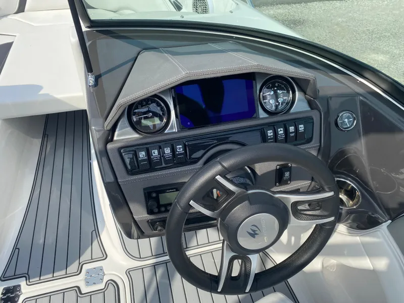 Slide: The Image of 2025 Monterey 224FS boat dashboard with steering wheel and control panel. - 11