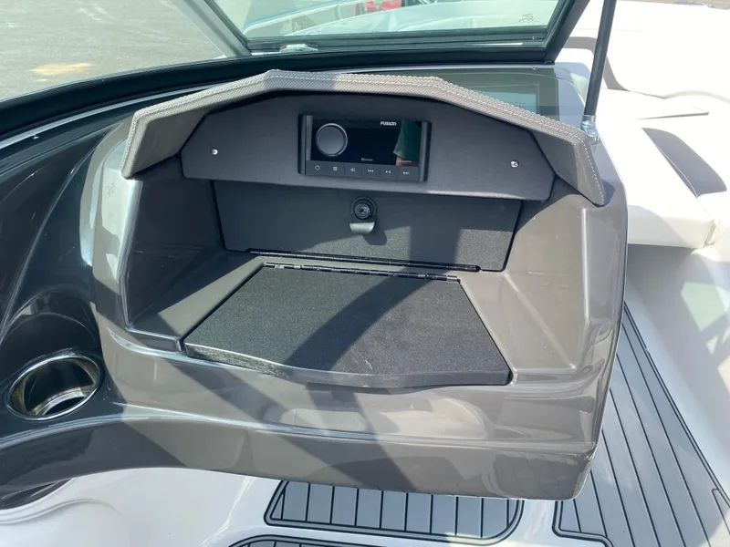 Slide: The Image of 2025 Monterey 224FS boat dashboard with stereo system and sleek design. - 13