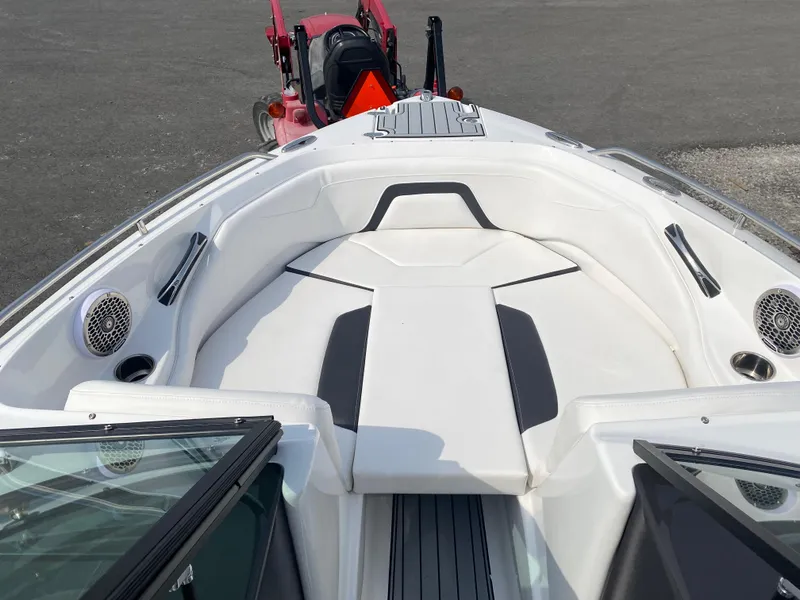 Slide: The Image of 2025 Monterey 224FS boat interior with white seating and black accents. - 14