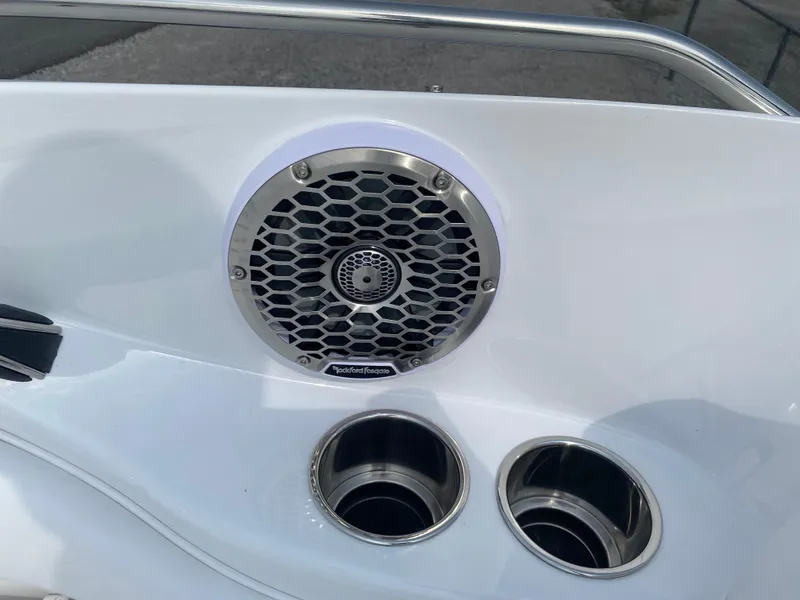 Slide: The Image of 2025 Monterey 224FS boat speaker and cup holders on white deck. - 15