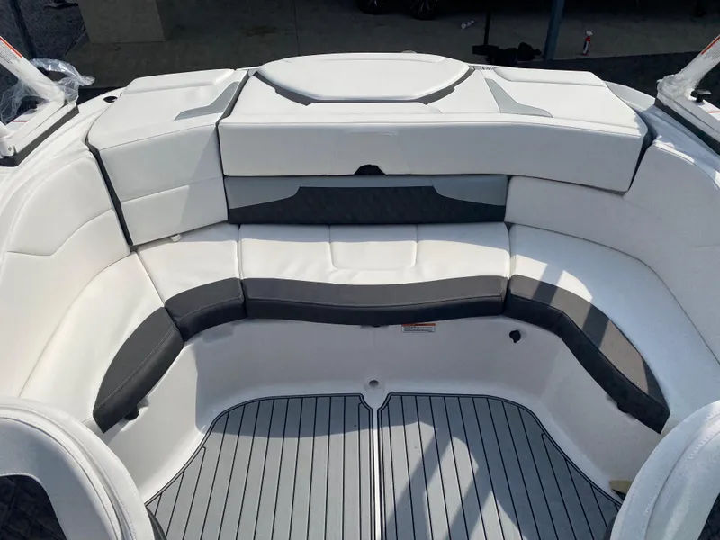 Slide: The Image of 2025 Monterey 224FS boat interior with white and gray seating, featuring sleek design and spacious layout. - 19