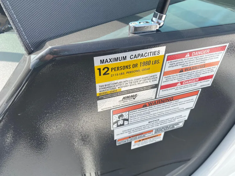 Slide: The Image of 2025 Monterey 224FS boat capacity label, maximum 12 persons or 1980 lbs, safety warnings visible. - 20