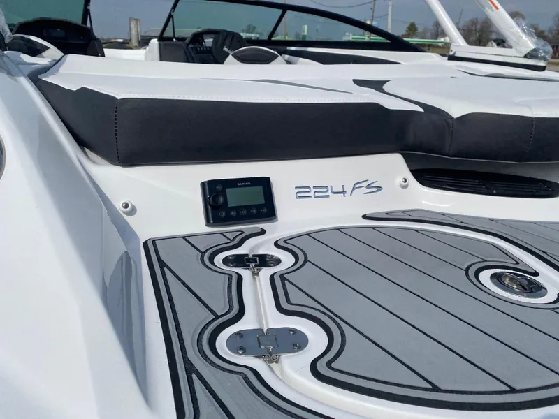 Slide: The Image of 2025 Monterey 224FS boat with sleek design and modern dashboard features. - 8