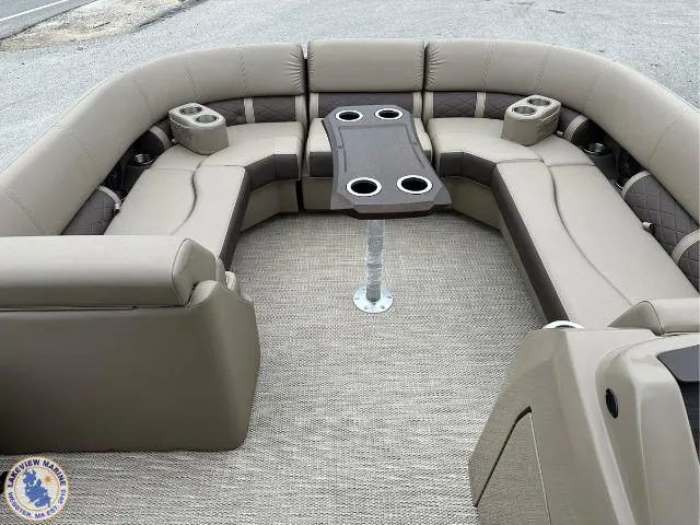 Slide: The Image of 2024 Bennington 23 LSRC pontoon boat interior with plush seating and cupholders. - 1