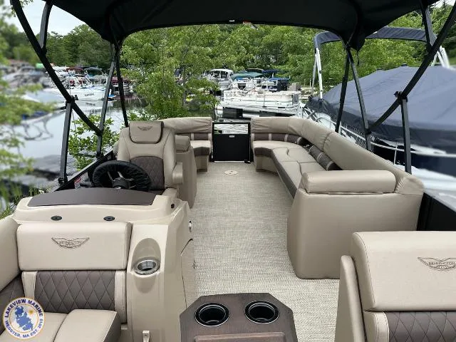 Slide: The Image of 2024 Bennington 23 LSRC pontoon boat with spacious seating and elegant interior design. - 4