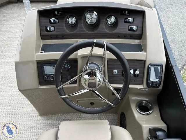 Slide: The Image of 2024 Bennington 23 LSRC boat dashboard with steering wheel and control panel. - 5