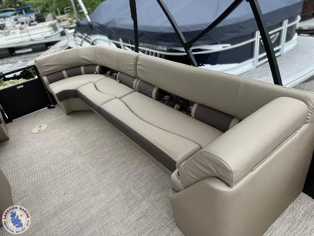 Slide: The Image of 2024 Bennington 23 LSRC boat interior with beige seating and carpeted floor. - 6