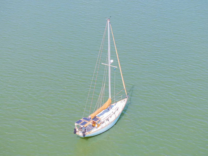 Slide: The Image of Sailboat on calm water, 1981 Bristol 40 model, aerial view. - 1