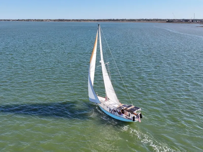 Slide: The Image of Sailboat on open water, 1981 Bristol 40 model, cruising under clear skies. - 13