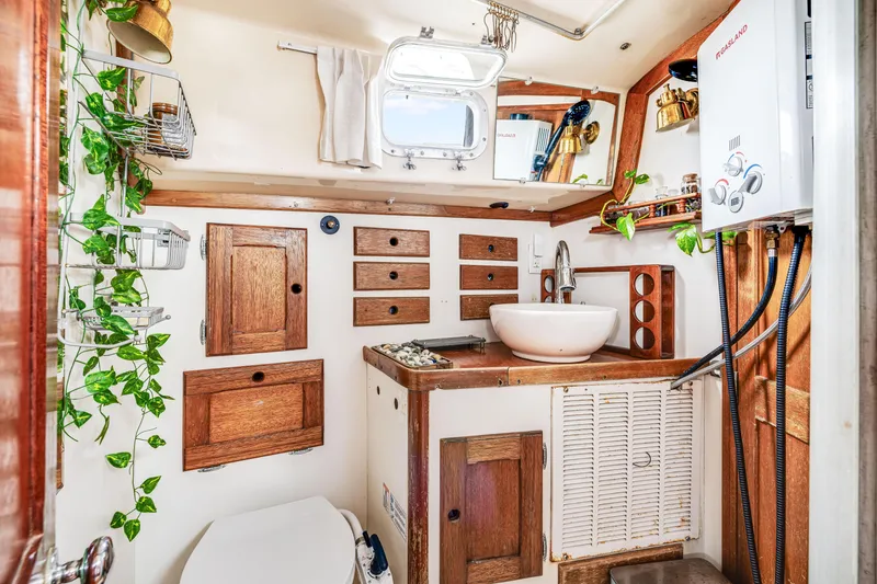 Slide: The Image of Compact 1981 Bristol 40 boat bathroom with wooden cabinets and modern fixtures. - 28