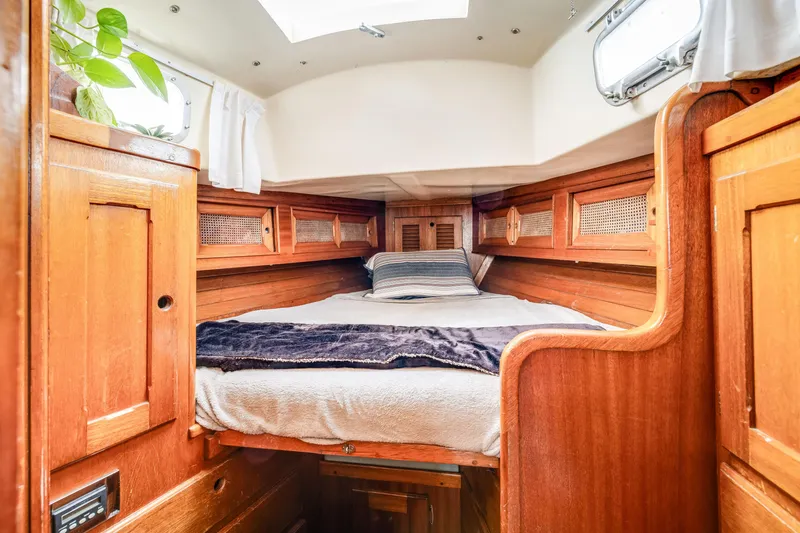 Slide: The Image of 1981 Bristol 40 yacht interior with cozy wooden cabin and bed. - 33