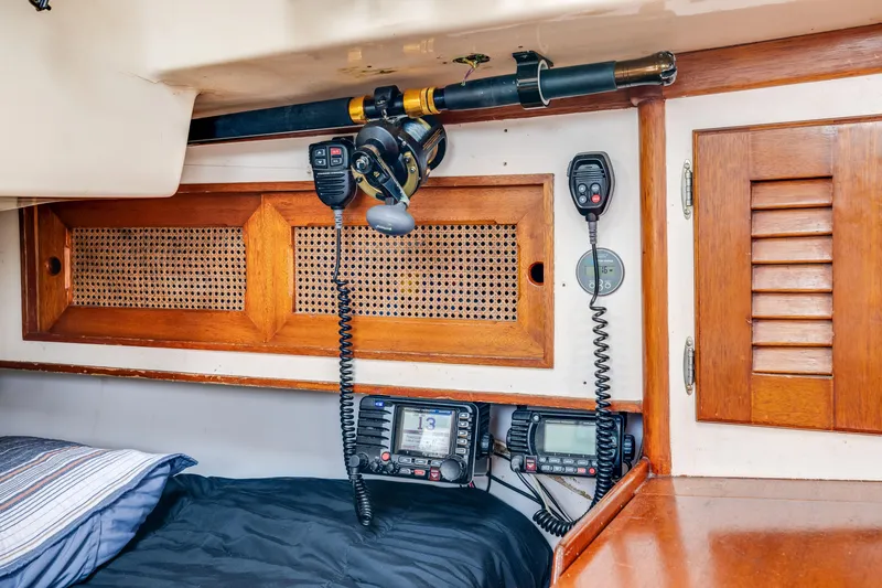 Slide: The Image of 1981 Bristol 40 yacht interior with communication equipment and wooden cabinetry. - 35