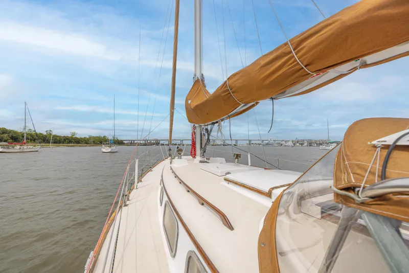 Slide: The Image of 1981 Bristol 40 sailboat on calm waters with clear skies. - 44
