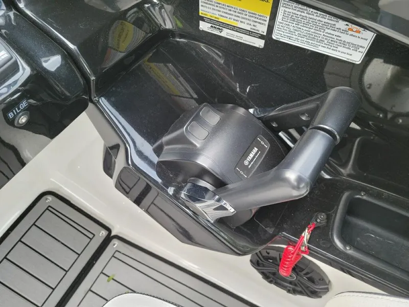 Slide: The Image of Throttle control of 2018 Yamaha Boats 242 Limited S, featuring sleek design and ergonomic handle. - 12