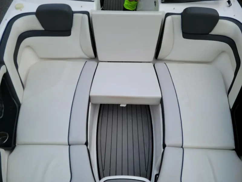 Slide: The Image of 2018 Yamaha Boats 242 Limited S interior seating, featuring white and gray cushioned seats. - 9