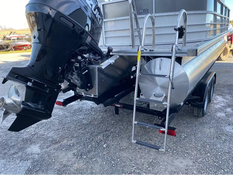 Slide: The Image of 2024 Berkshire LE Series 22RFX LE pontoon boat with Suzuki outboard motor and ladder. - 17