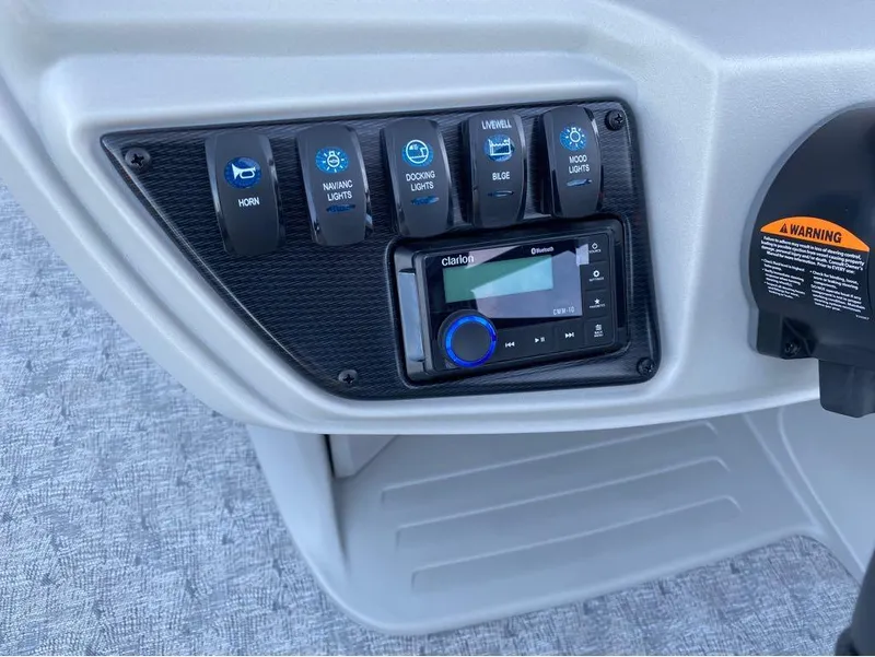 Slide: The Image of Control panel of 2024 Berkshire LE Series 22RFX LE with switches and audio system. - 19