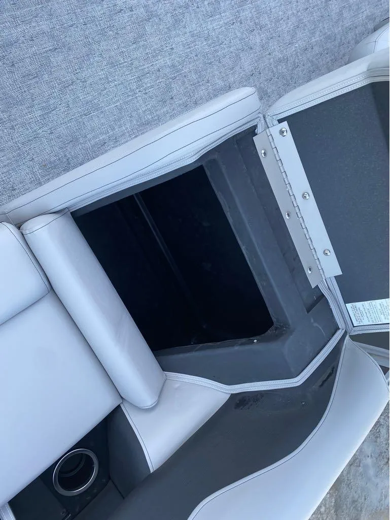 Slide: The Image of 2024 Berkshire LE Series 22RFX LE boat seat with open storage compartment. - 4