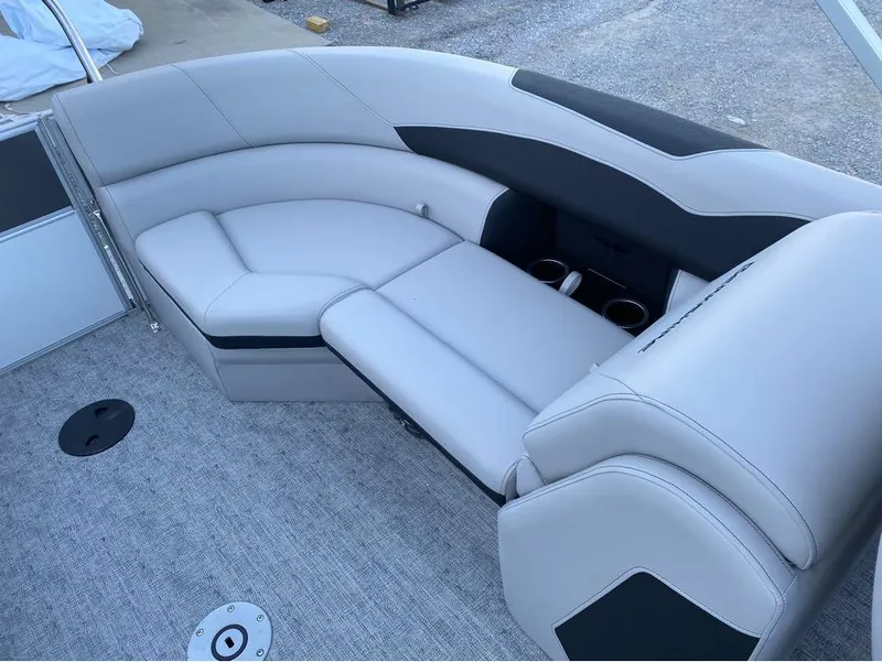 Slide: The Image of 2024 Berkshire LE Series 22RFX LE boat interior with plush seating and cup holders. - 5