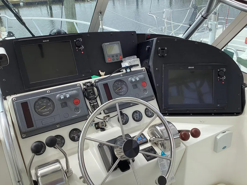 Slide: The Image of Control panel of a 2001 Henriques 28 Express boat with navigation instruments. - 15