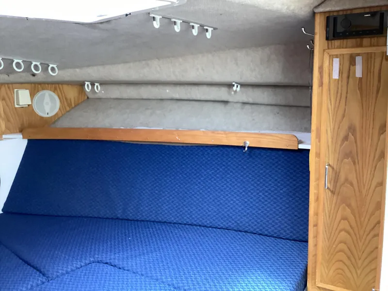 Slide: The Image of 2001 Henriques 28 Express cabin interior with blue seating and wooden cabinetry. - 20