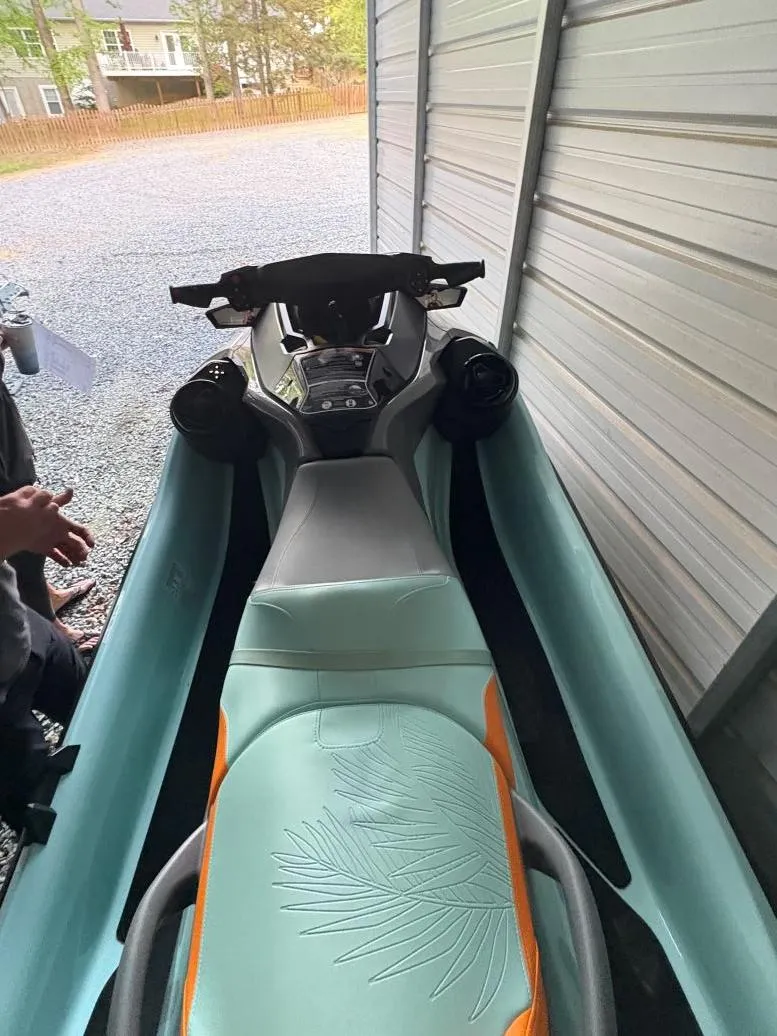 Slide: The Image of 2022 Sea-Doo Wake Pro 230 in storage, showcasing sleek design and comfortable seating. - 11