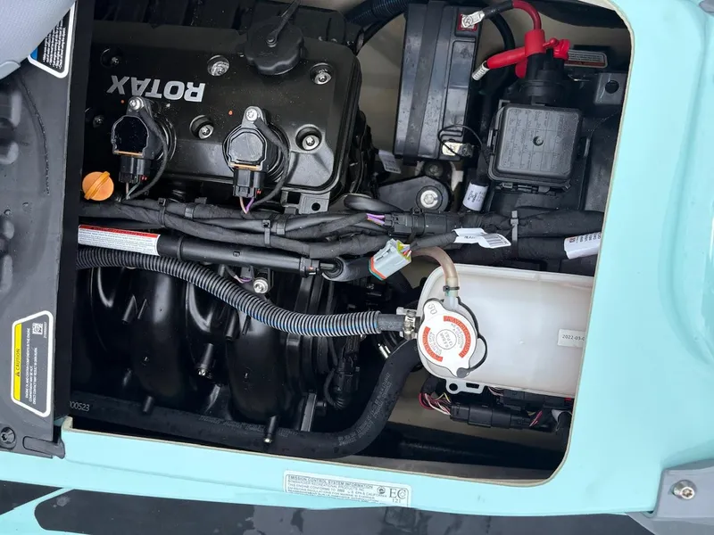 Slide: The Image of 2022 Sea-Doo Wake Pro 230 engine compartment with Rotax engine components visible. - 13