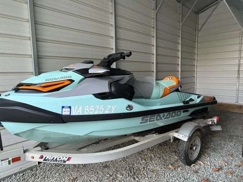 Slide: The Image of 2022 Sea-Doo Wake Pro 230 on trailer in a metal shed. - 6