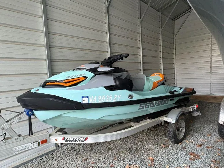 Slide: The Image of 2022 Sea-Doo Wake Pro 230 jet ski on trailer in storage shed. - 7