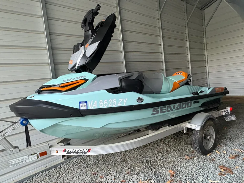 Slide: The Image of 2022 Sea-Doo Wake Pro 230 jet ski on trailer in a garage. - 8