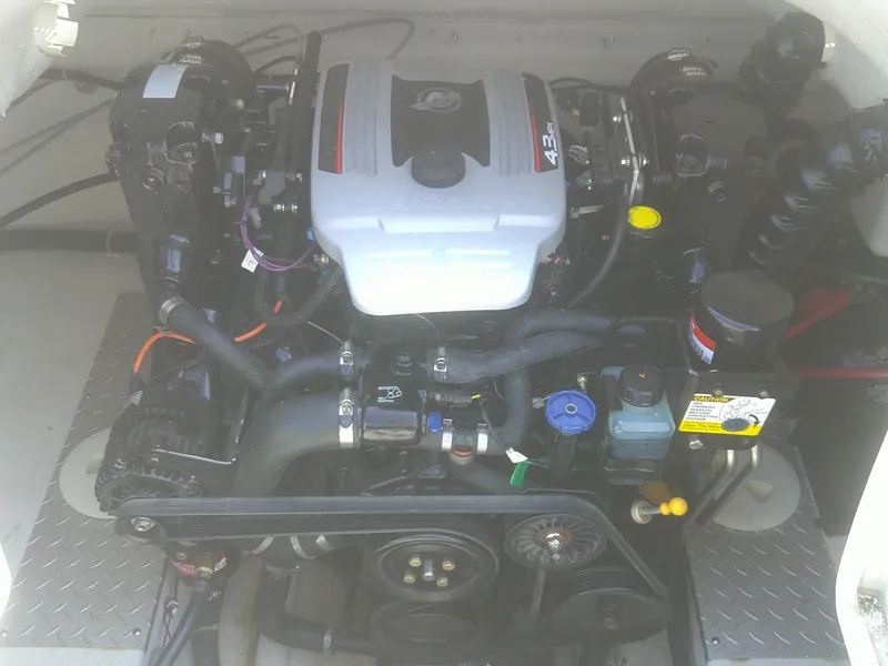 Slide: The Image of Engine of 2011 Hurricane SunDeck Sport 188 IO boat, showcasing intricate mechanical components. - 10