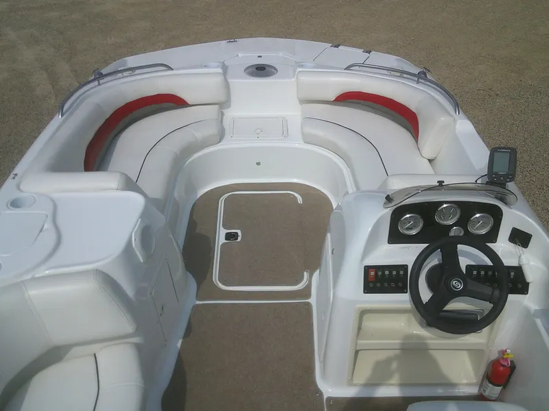 Slide: The Image of 2011 Hurricane SunDeck Sport 188 IO boat interior with white seating and red accents. - 4