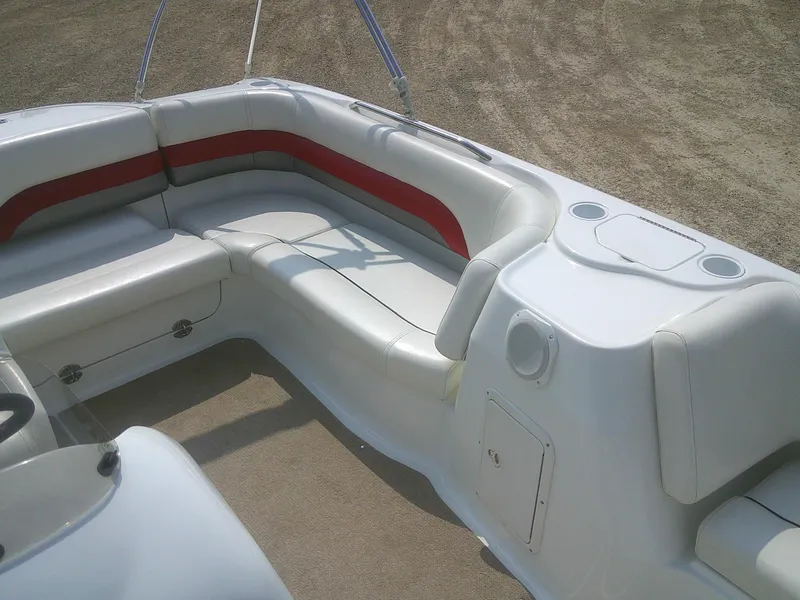 Slide: The Image of 2011 Hurricane SunDeck Sport 188 IO boat interior with white and red seating. - 5
