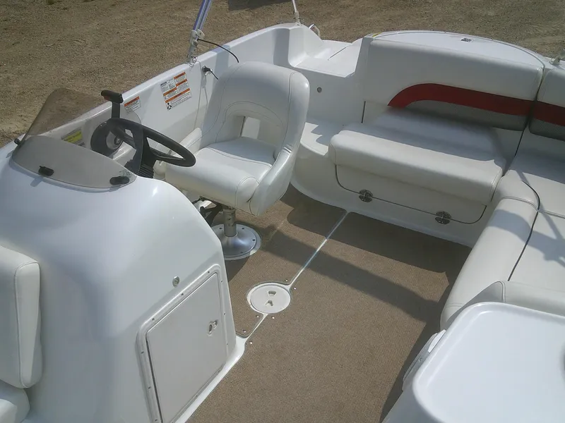 Slide: The Image of 2011 Hurricane SunDeck Sport 188 IO boat interior with seating and steering wheel. - 6