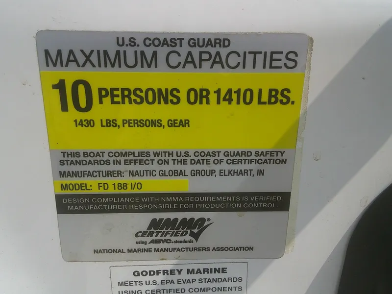 Slide: The Image of U.S. Coast Guard capacity label for 2011 Hurricane SunDeck Sport 188 IO, 10 persons or 1410 lbs. - 7