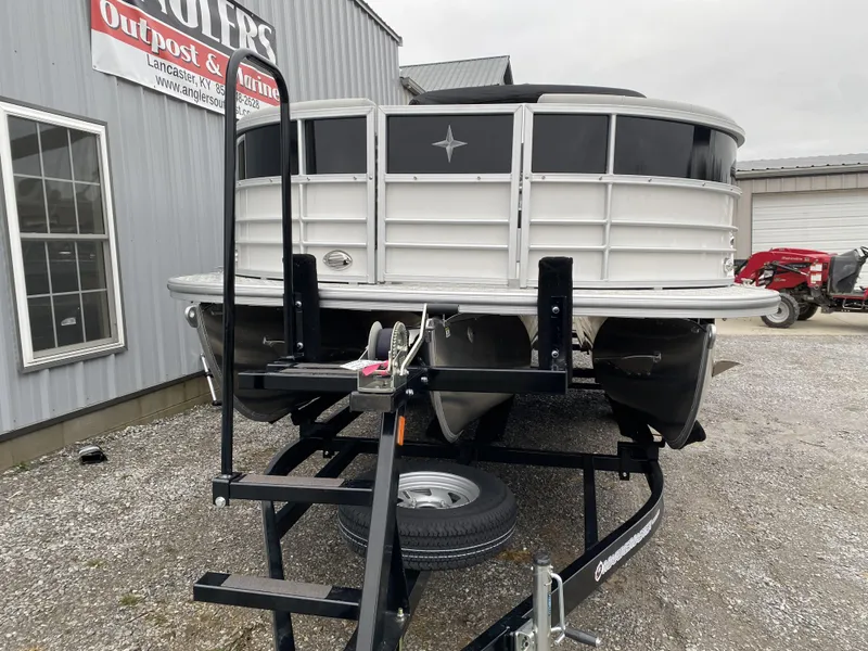 Slide: The Image of 2024 Berkshire 24RFX LE pontoon boat on trailer at dealership. - 16