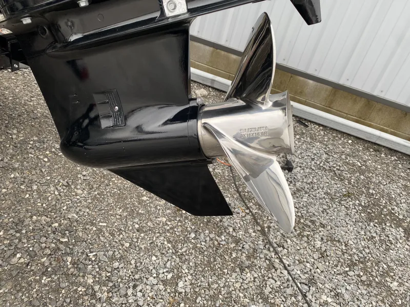 Slide: The Image of 2024 Berkshire 24RFX LE boat propeller on gravel surface. - 22