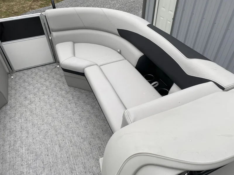 Slide: The Image of 2024 Berkshire 24RFX LE boat interior with gray seating and cup holders. - 5
