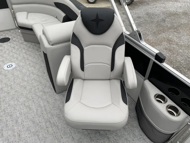 Slide: The Image of 2024 Berkshire 24RFX LE boat interior with plush seating and cup holders. - 7