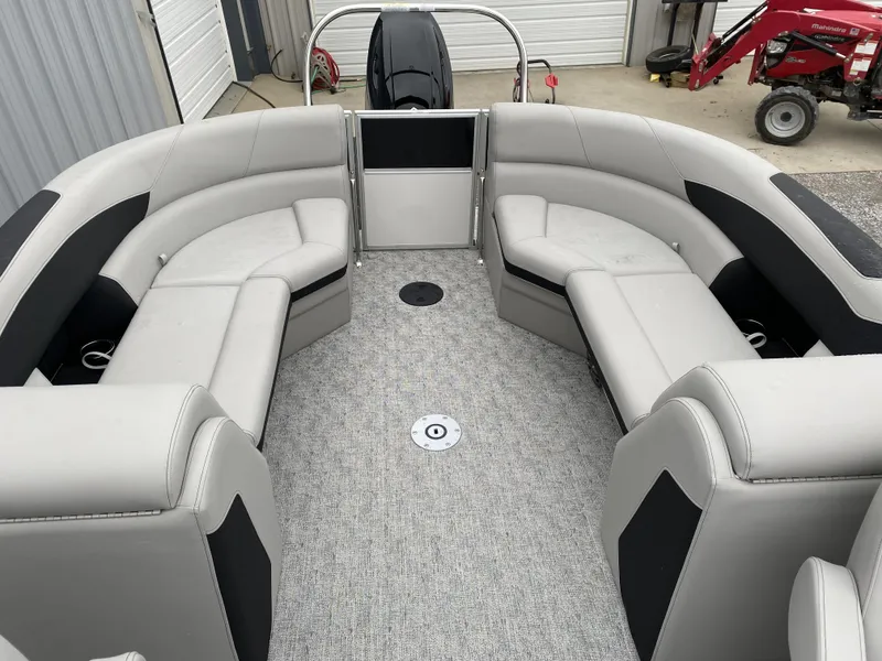 Slide: The Image of 2024 Berkshire 24RFX LE pontoon boat interior with gray seating and carpet. - 8
