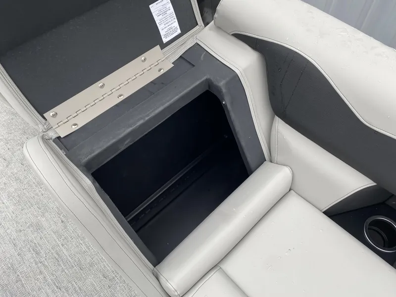 Slide: The Image of Open storage compartment in 2024 Berkshire 24RFX LE boat seat. - 9