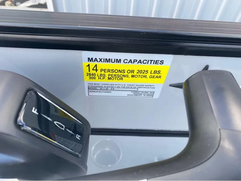 Slide: The Image of 2025 Berkshire 25 SB2 STS boat capacity label, 14 persons or 2025 lbs, 300 HP motor. - 19