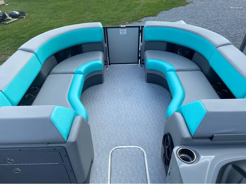 Slide: The Image of 2025 Berkshire 25 SB2 STS pontoon boat with teal and gray seating, spacious interior. - 4