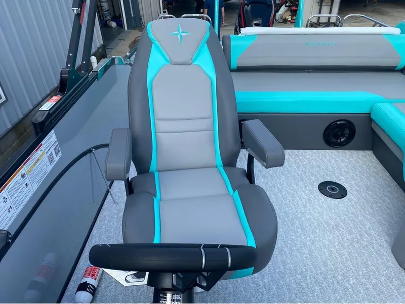 Slide: The Image of 2025 Berkshire 25 SB2 STS boat seat with gray and turquoise upholstery. - 5