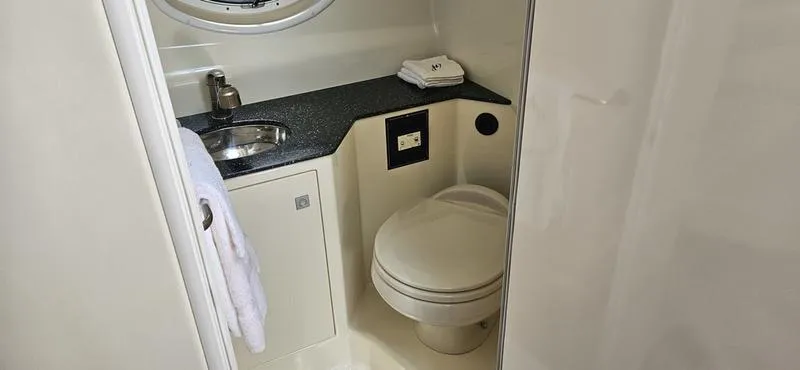 Slide: The Image of 2015 Monterey 295 Sport Yacht bathroom with sink, toilet, and countertop. - 14
