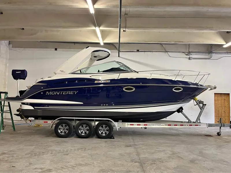 Slide: The Image of 2015 Monterey 295 Sport Yacht on trailer in indoor storage facility. - 3