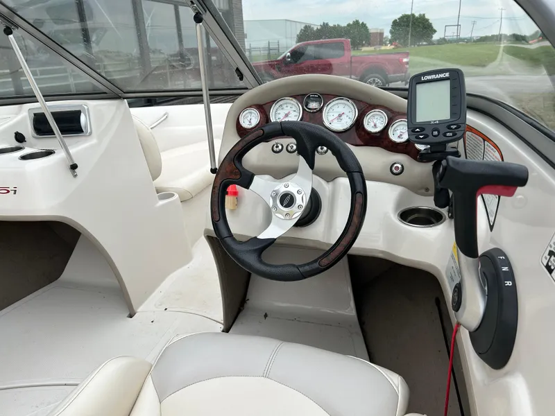Slide: The Image of Steering console of a 2010 Tahoe Q5SI boat with gauges and navigation system. - 6