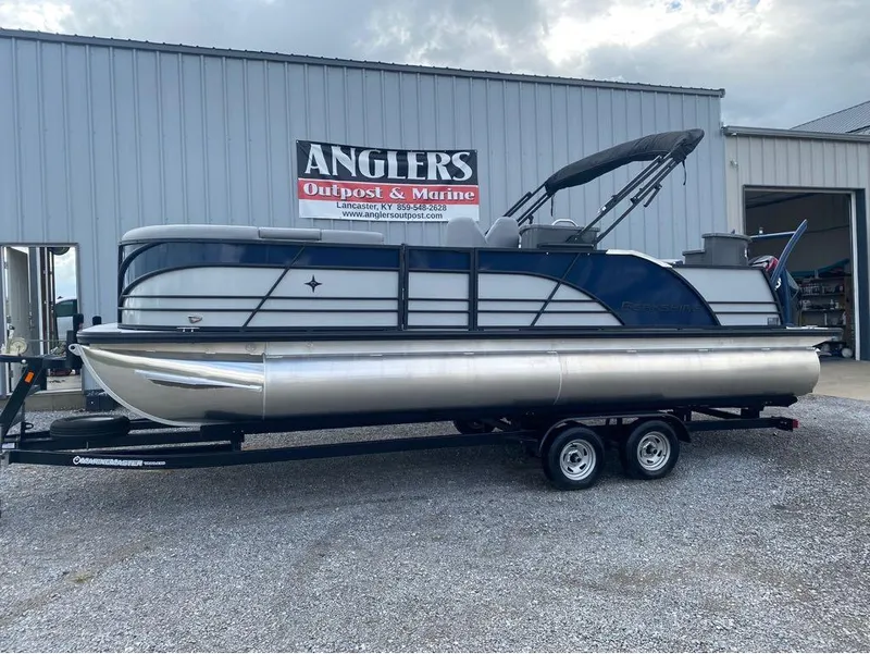 Slide: The Image of 2025 Berkshire 23E STS pontoon boat on trailer at Anglers Outpost & Marine. - 0