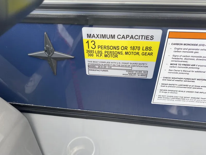 Slide: The Image of 2025 Berkshire 23E STS boat capacity label, maximum 13 persons or 1870 lbs, 300 HP motor. - 12