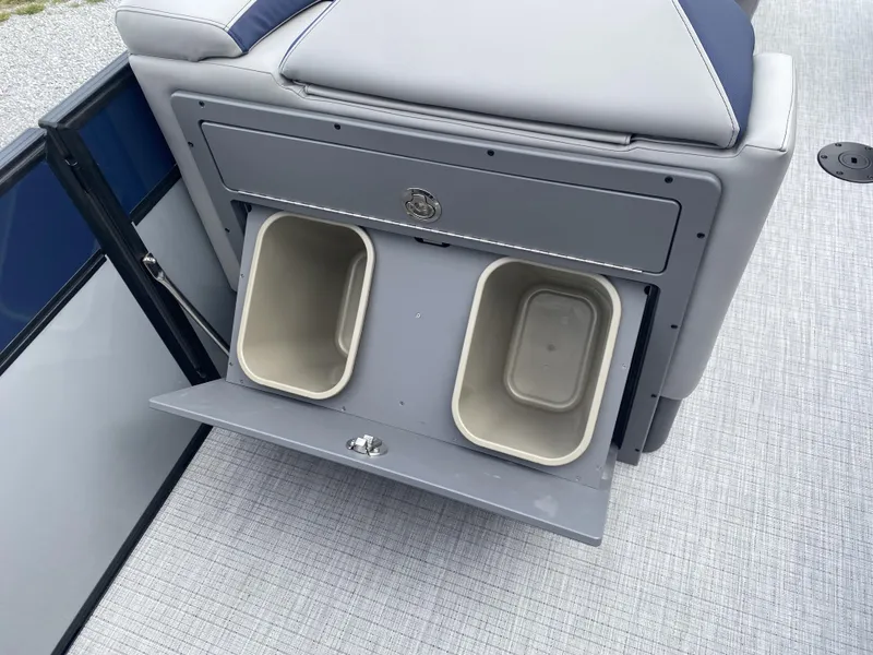 Slide: The Image of Interior storage compartment with bins in 2025 Berkshire 23E STS boat. - 13